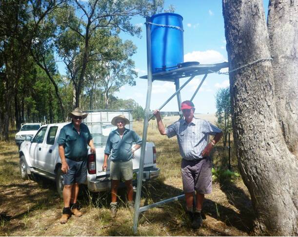 Geoff Dawson with GULG members Bruce Higham and Malcolm Heath at his Emerald Hill property where a Blinky Drinker has been installed. Photo: Rod Browne, GULG