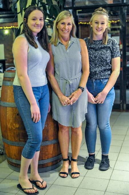 Overseas adventure: St Mary's 2016 Year 12 students Georgia Woodward (left) and Carrie Woods (right) with teacher Karen Mooney ahead of their journey to Cambodia. Photo: Kate Oram