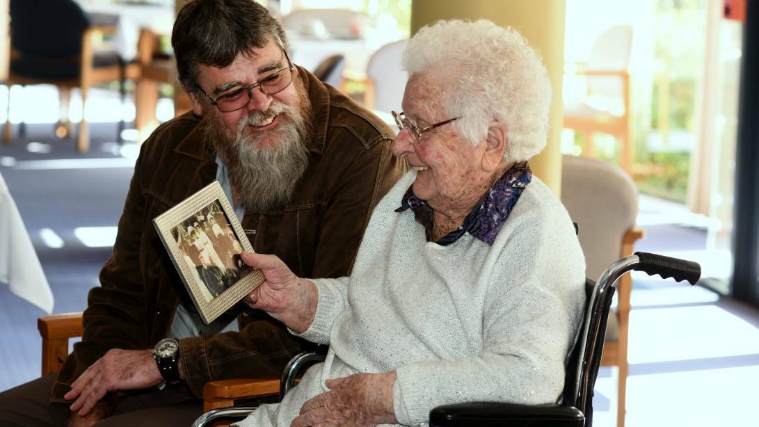 HISTORY: Michael Stanton gives Iris Roden a photo of her family taken in 1905 as a present for her 105th birthday. Picture: Neil Richardson.