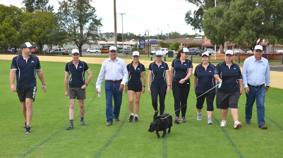 GETTING ACTIVE: Members of the Whitehaven Coal Gunnedah team, Joel McKenty, Chris Mammen,Tim Muldoon, Sandra Donnelly, Jessica Pereira, Kirsten Gollogly,  Renee Bedggood, Maggie Raguenes, Bob Sutherland and Lou Lou the dog are getting in the spirit of the Health Haven program. Photo: Billy Jupp