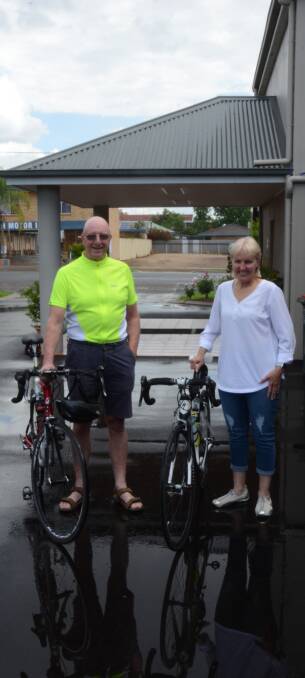 PIT STOP: Graeme Rapp and Eris Gillis take a break in Gunnedah as they ride from Narrabri to Sydney to raise funds and awareness for humanitarian causes.