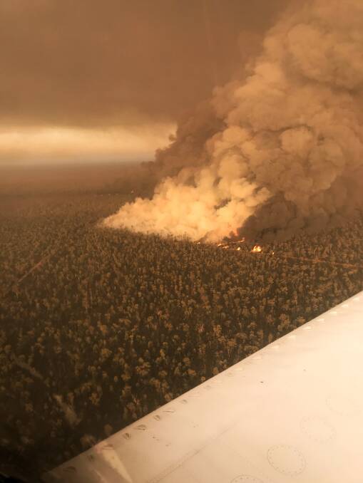 TEAM EFFORT: Rural Fire Service crews have been battling the bushfire in the Pilliga National Park from both the land and air. Photo: NSW RFS