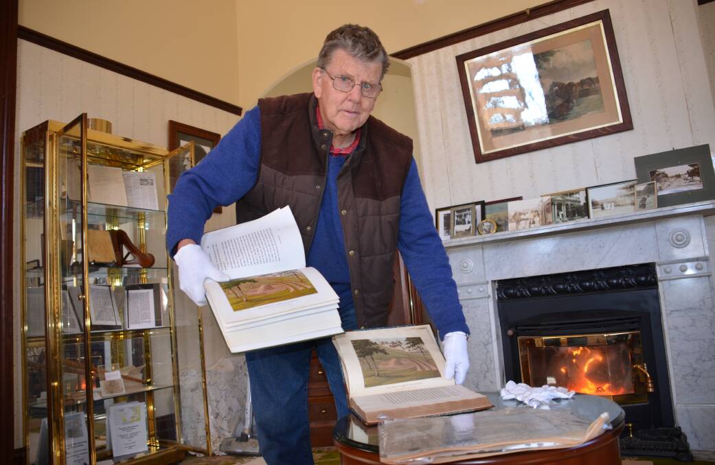 Barry Marshall in the Oxley room at his home Langford with an original John Oxley journal published in 1820 and the reproduction copy.
