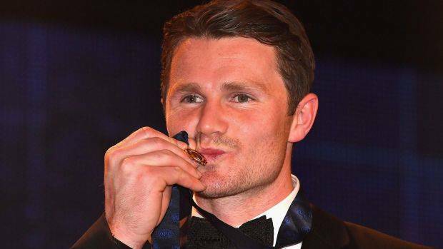 Patrick Dangerfield gives his Brownlow Medal a kiss. Photo: Quinn Rooney
