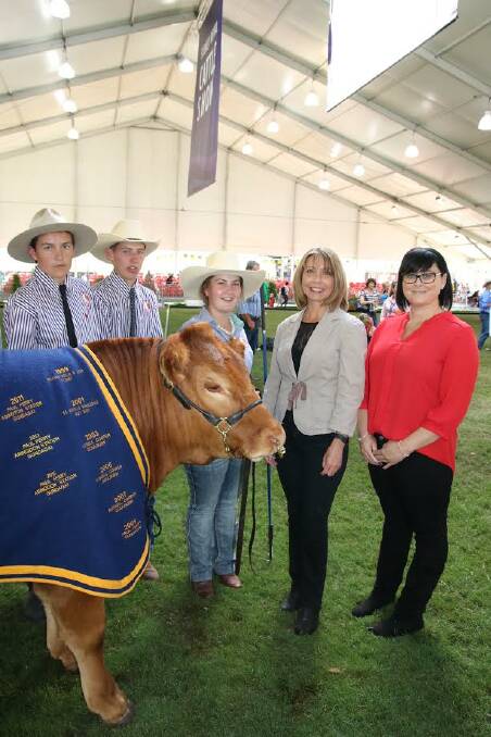 GREAT RESULT: Students from Harden's Murrumburrah High School, with donor heart recipients Fiona Coote of Tamworth and Melissa Hargrave from Penrith - and the charity steer auctioned off for the Victor Chang Cardiac Research Institute.