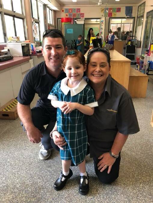 Chloe Chappel, who has survived acute lymphoblastic leukaemia - twice - with her dad Shane and mum Shelley, on her first day of school.