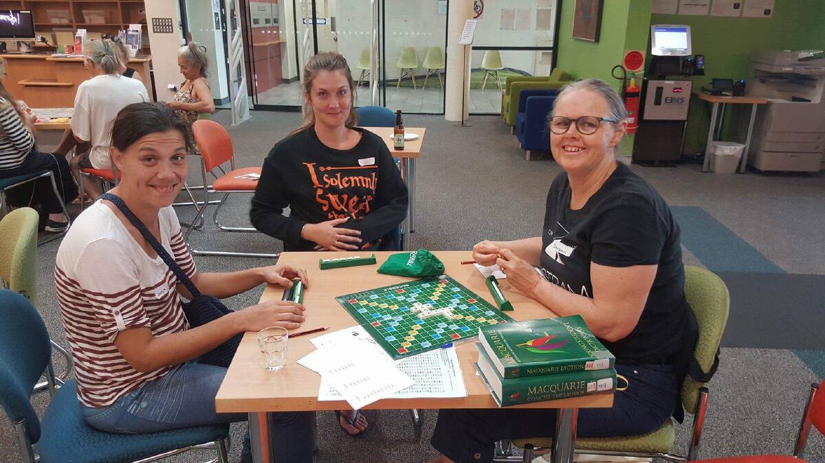 Vanessa Matthews, Rachel Robinson and Sue Langston cracked open a game of Scrabble.