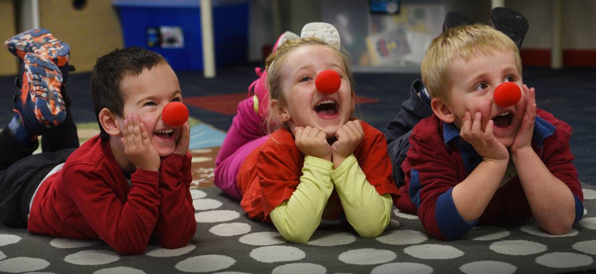 GO RED: Locke Millet-Jackson, Leilah Leech and Zac McDonald, all 4, geared up for Red Nose Day at Centrepoint. Photo: Gareth Gardner 290617GGA04