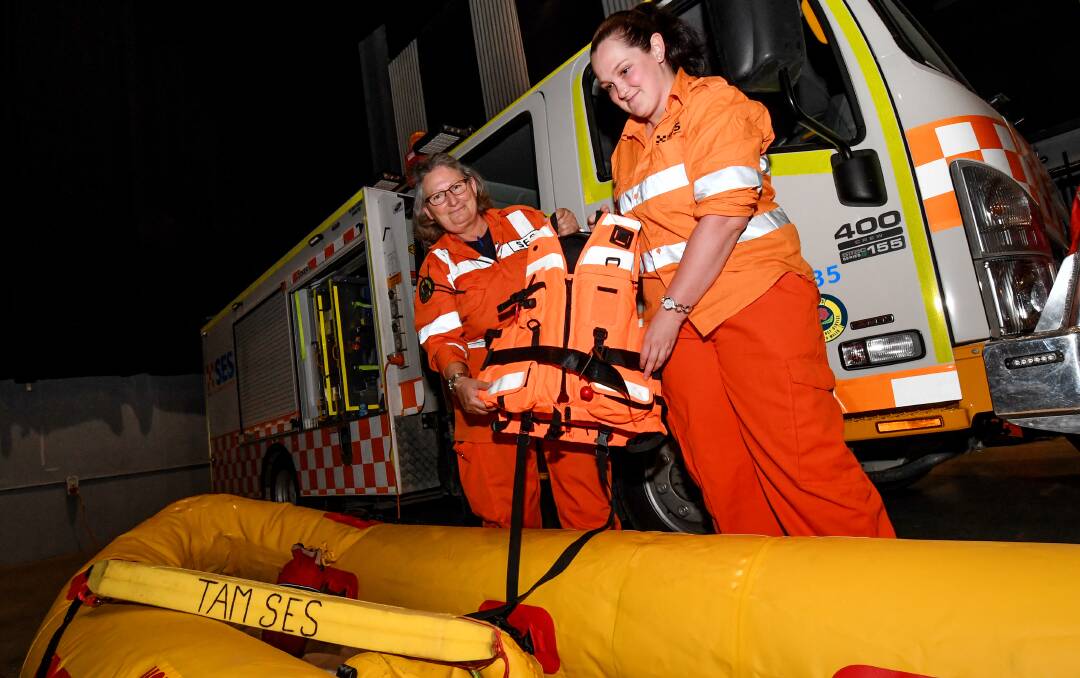GEAR: Yvonne Cini and Allisyn Dickson show off the SES boat - inflatable, capable of carrying two people and able to be moved by one. Photo: Gareth Gardner 191017GGB002