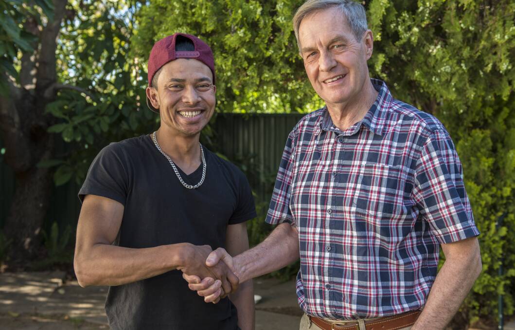 NEW HOME: Jamil Mohammed from Burma - one of about 80 SHEV holders already living and working in Tamworth - with Multicultural Tamworth vice-president Brian Lincoln. Photo: Peter Hardin 121016PHD008