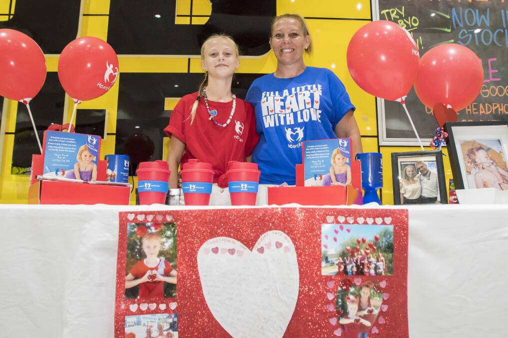 SHARING STORIES: Isabella Cooper and mum Amy helped to raise $350 for HeartKids at their Sweetheart Day stall. Photo: Peter Hardin 140218PHC022