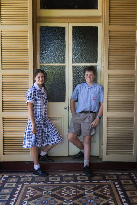 GREAT TO BE BACK: Pip and Charlie Traill at Calrossy Anglican School's Brisbane Street campus. Photo: Peter Hardin 070218PHC007