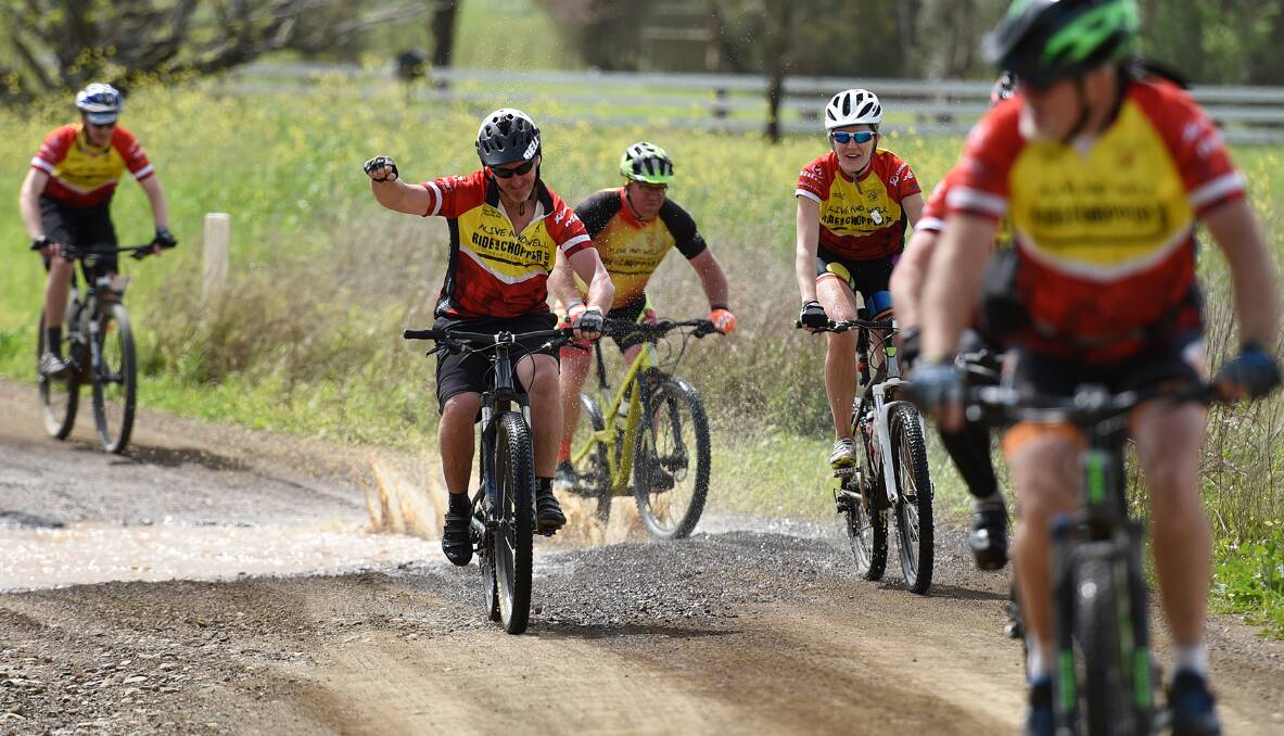 MAKING A SPLASH: The riders tear through Somerton on their last leg of the 2016 Westpac Ride for the Chopper, which ended in Tamworth yesterday. Photo: Gareth Gardner 230916GGC06
