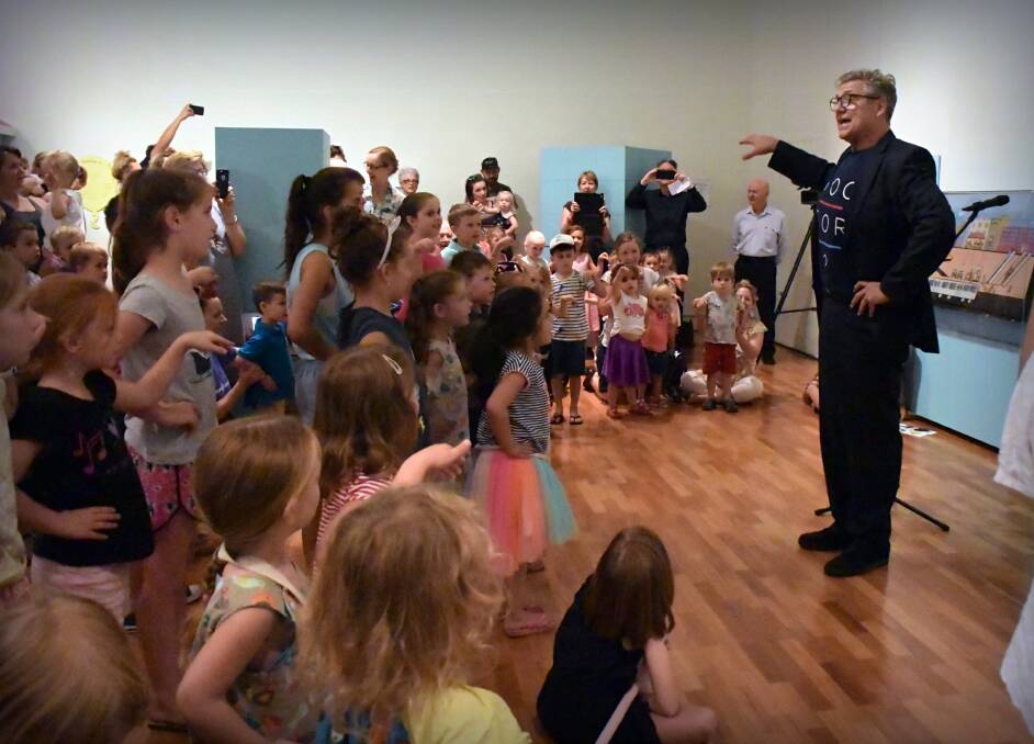 LITTLE TEAPOT: Longtime former Play School host and exhibition opening special guest Philip Quast shares a song and dance with the children at the gallery. 100218CMA12