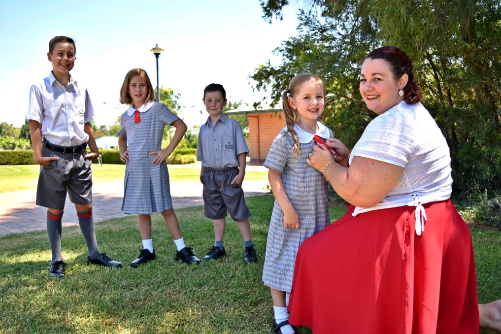 BUSY: The Owens kids - Xavier (11), Jocelyn (9), Quentin (6) and Felicity (5) - who will all attend the same school this year, and mum Kristen. Photo: Ben Jaffrey 220118BJ44 