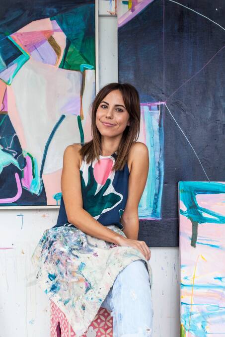 COLOURFUL: Annie Everingham in painting mode. Photo: Sophie Tyler Photography