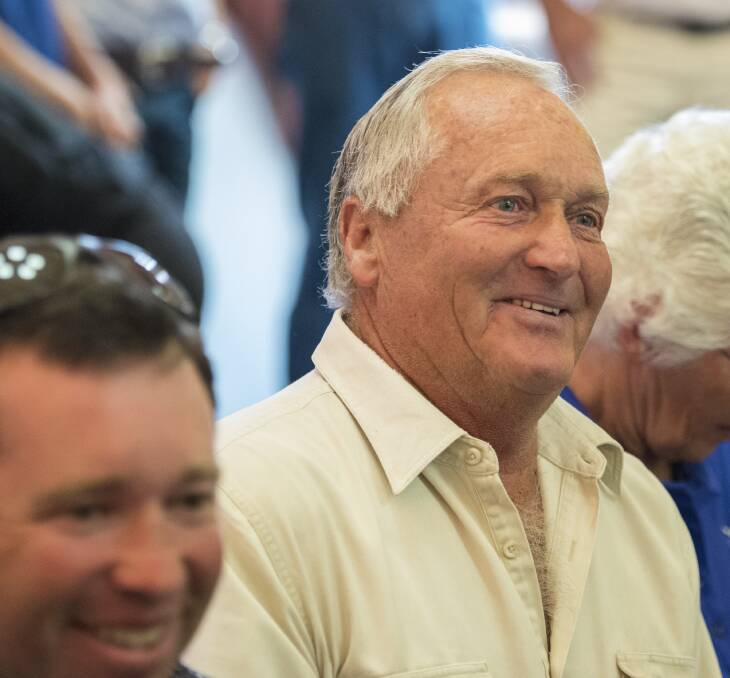 Trevor Coombes, with son Richard in the foreground, reacts to the news of his family's winning bid. Photo: Peter Hardin 301116PHC098