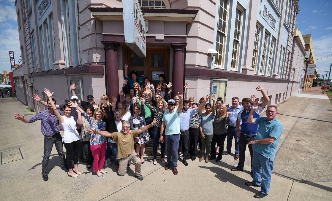GOODBYE: Tamworth's Fairfax staff say farewell to their old building on Friday.