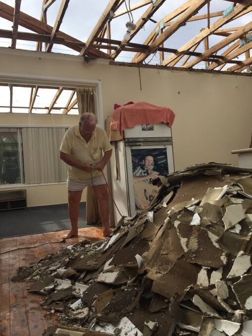 Gunnedah's Toney Baldwin cleans up what is left of his Wandobah Road home.