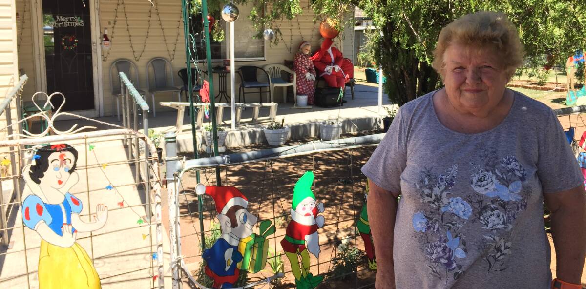 Disappointed: Barb Smith outside her Boggabri home and well-known Christmas light display that was the target of vandals on Wednesday.