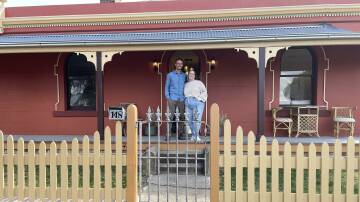 Jesse Dick and Tahlia Stewart outside their renovated, historical home, which is now unofficially on the Armidale Heritage Bus Tour.