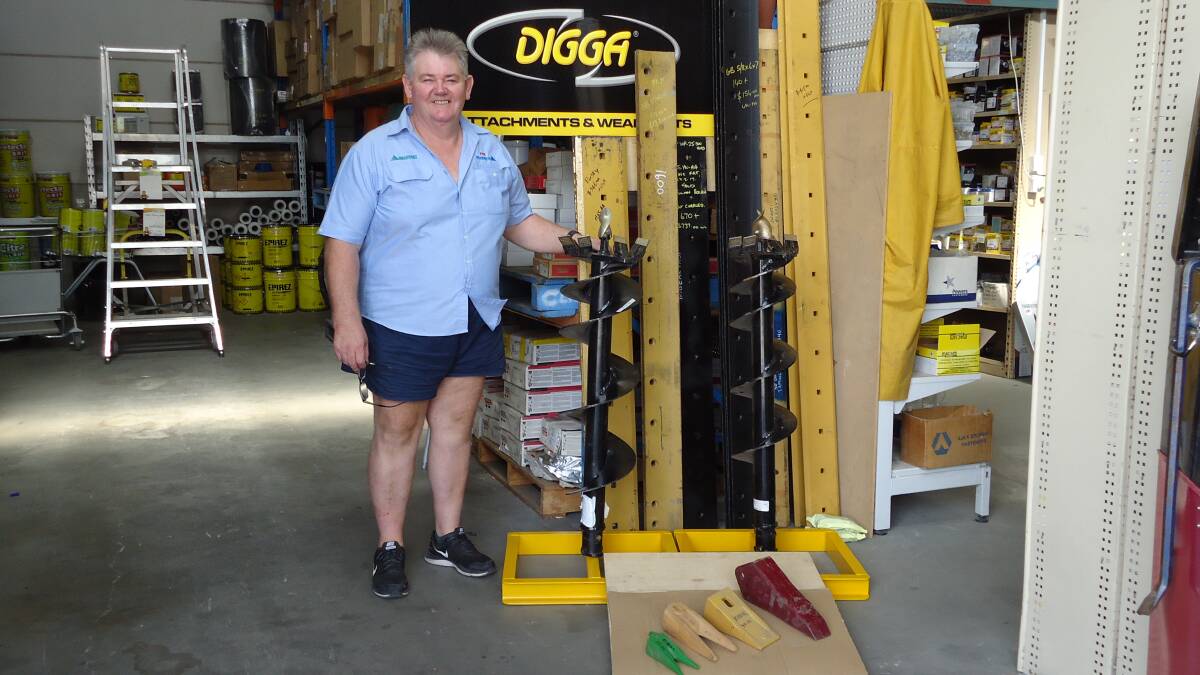 TRUE BLUE QUALITY: Phil Taylor with some of the Digga products now sold at Bearfast. The manufacturer provides more than 79 separate parts for most machine types, such as rotary axes, buckets and tillers.