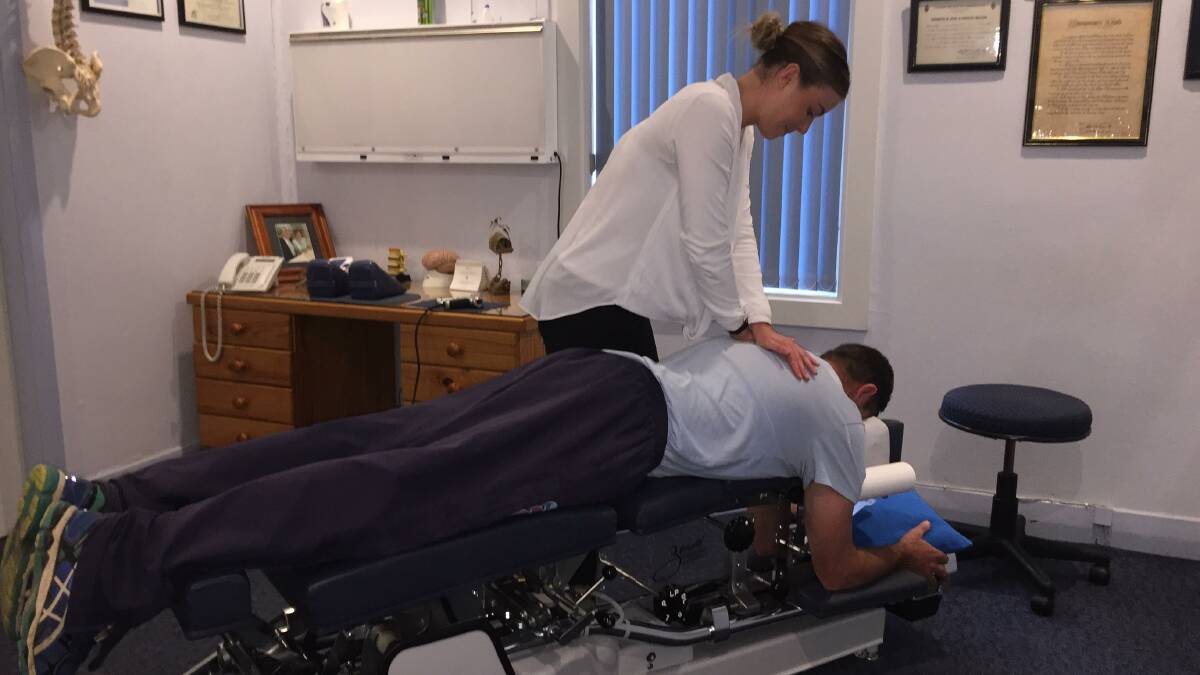 HEALING HANDS: Tamworth chiropractor Rachel Ostler uses a non-invasive, drug-free therapy to correct misalignments and restore function to a patient's nervous system. The "popping" sound is the release of nitrogen gas bubbles.