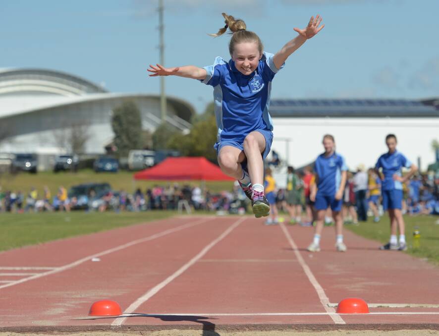 Annalise Hewitt is flying over the pit for a huge long jump at the carnival in Tamworth last week.  Photo: Peter Hardin 190816PHC09