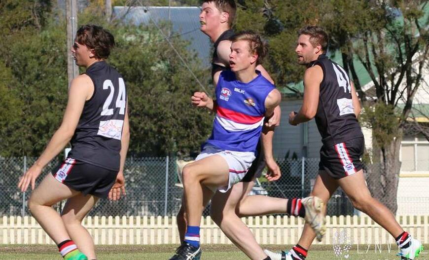 Young kicker: Gunnedah AFC Bulldogs teen star Ben Maher, pictured centre, has been a standout youngster of the TAFL competition this season.