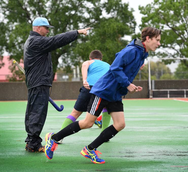 That way: Coach Blair Chalmers gives some direction to some aspiring NIAS hockey athletes in the first round of trials for the 2017 program on Saturday. Photo: Gareth Gardner 221016GGA02