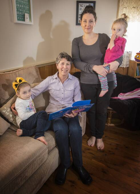 Action stations: Former community midwife Katy O'Neill with action group chief Sam Wibberley and her daughters Willow and Essie. Photo: Peter Hardin 160517