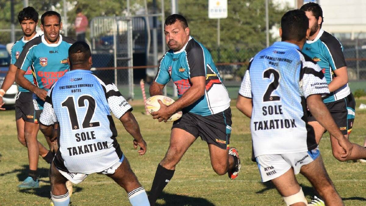 Macintyre's Aaron Robinson charges into the Moree Boars defence as his side charge into a home semifinal this weekend in Boggabilla.