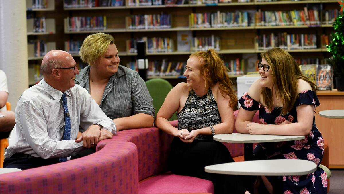 Schools out: Peel principal Rod Jones celebrates the HSC results with Curtis Wolrige, Laura O'Connor and Emily Castles. Photo: Gareth Gardner