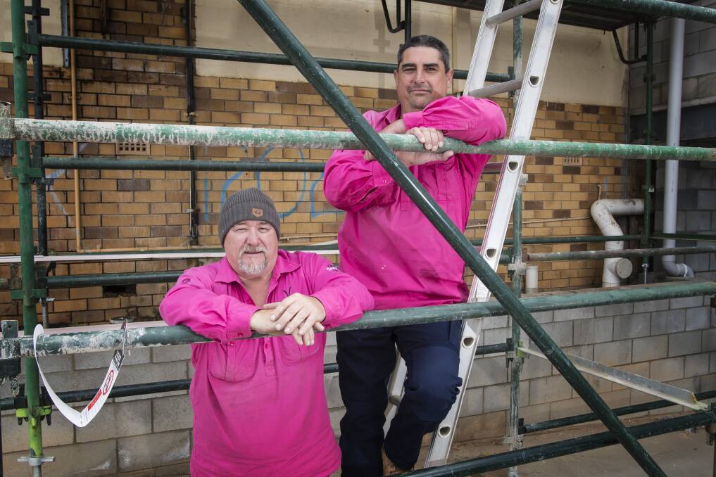 Simple solution: Matt Whitson and Gary Sinclair are taking their breast cancer awareness campaign into Newcastle, after Tamworth tradies jumped on board the pink brigade. Photo: Peter Hardin.