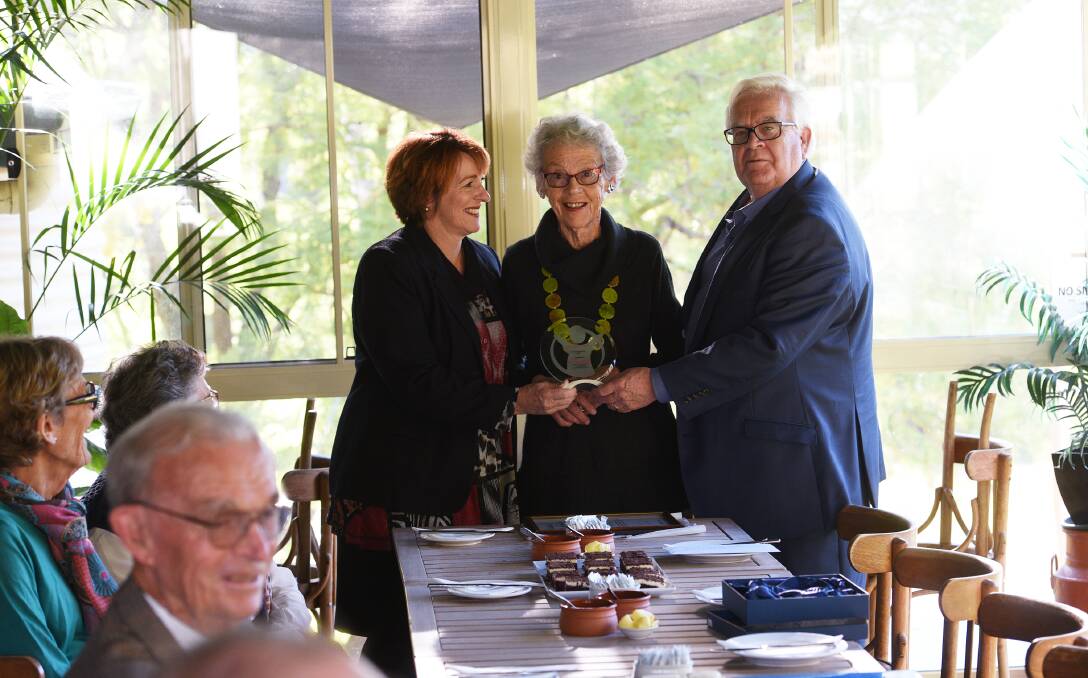 Honouring a legacy: Sharon Draper and Mark Sim honour Rosemary Campbell with a lifetime membership. Photo: Gareth Gardner 160617