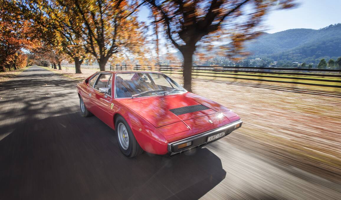 Legendary: Tamworth's Roddy Wyllie takes his 1976 Ferrari 308 GT4 for a spin as the iconic car brand celebrates 70 years of motoring glory. Photo: Peter Hardin