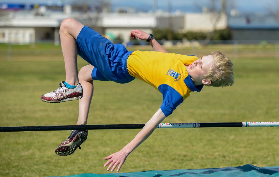 Nick Newsome clears the high jump bar and then some at the Catholic Schools athletics carnival in Tamworth. Photo: Peter Hardin 190816PHC61