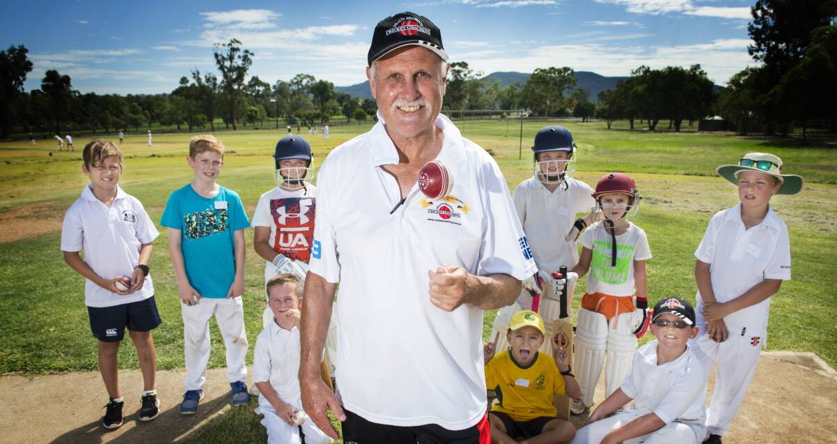 Top tips: Former Australian Test spinner Ray Bright took a few local kids under his wing at a cricket camp in Tamworth on Wednesday. Photo: Peter Hardin 110117PHA015