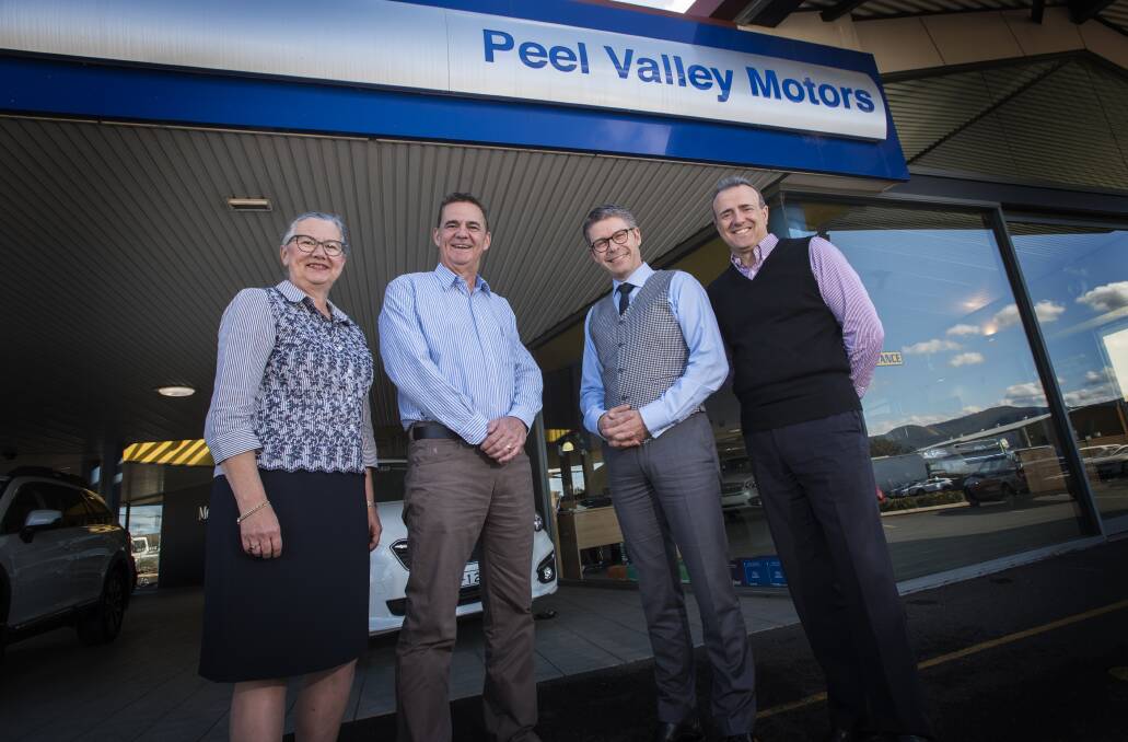 Change over: Libby Khan and Steve John recently handed the keys to their dealership over to Mark Woodley and John Riolo.