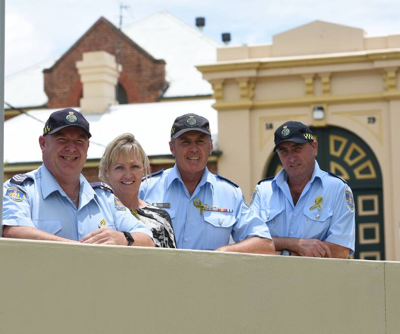 Behind the walls: Corrective Services workers Paul Day, Kim Vickery, Rusty Smith and Paul Macari outside the Tamworth facility. Photo: Gareth Gardner 200117GGD04