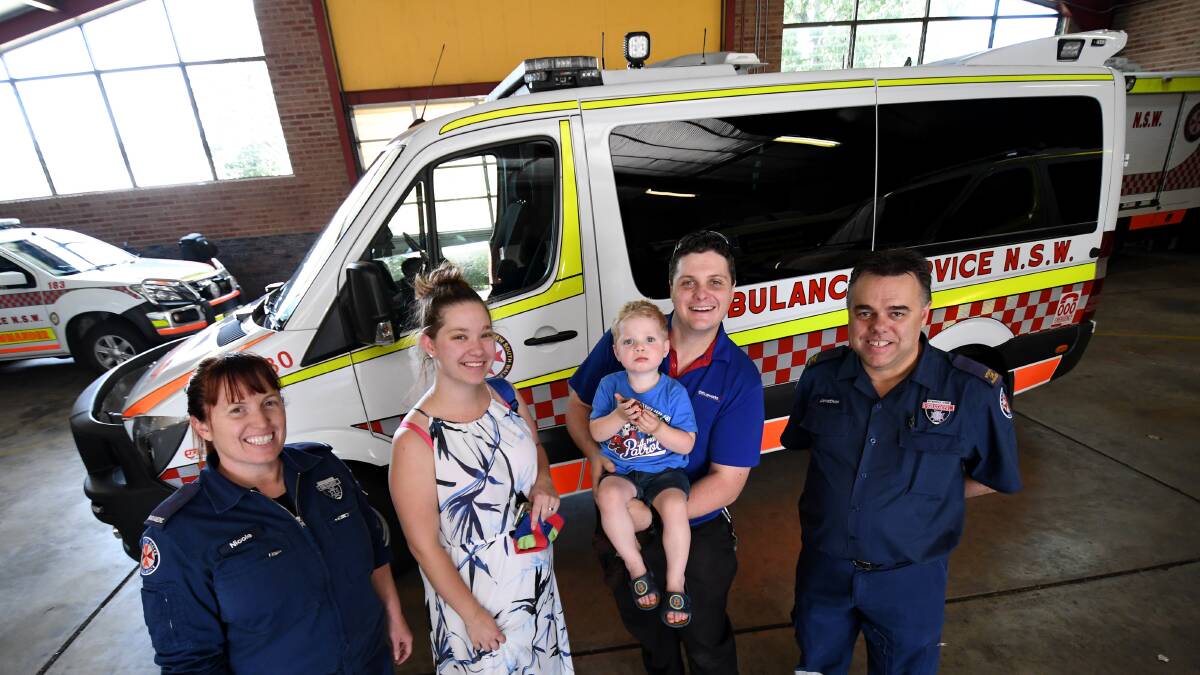 Happy family: Paramedics Nicole Beacroft and Jonathan Powell flank Natasha, Theo and David Rose after the fmaily dropped in to thank the officers for saving Theo's life.