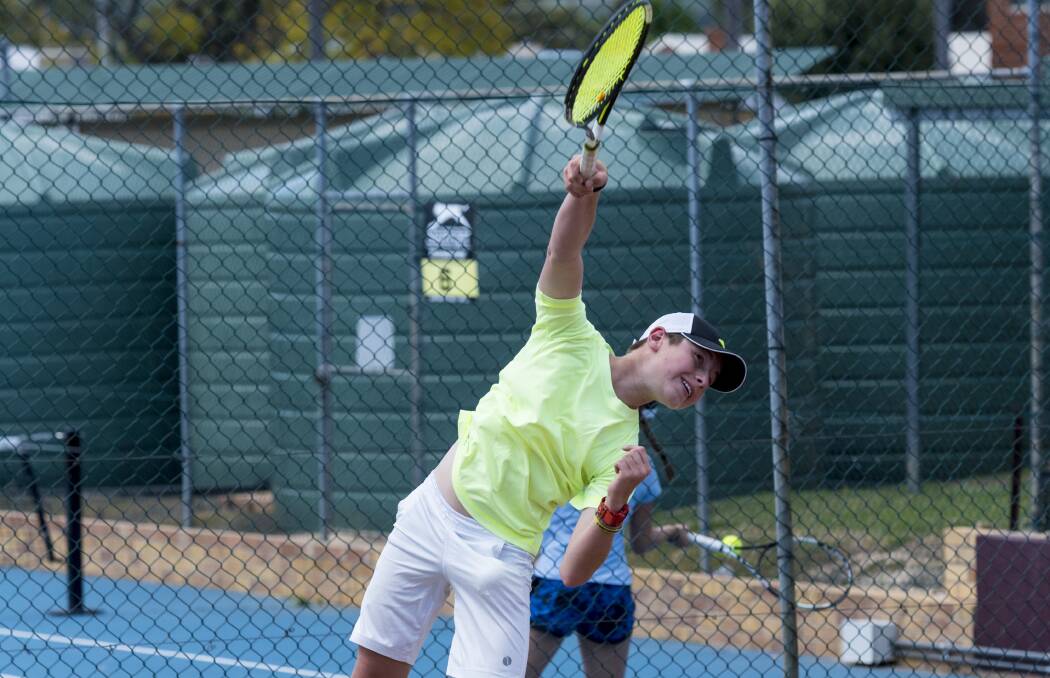 Ace: Cooper Griffiths from Bonnel Bay fires a serve over the net as West Tamworth hosted the AMT series over the weekend. Photo: Peter Hardin 141016PHI011
