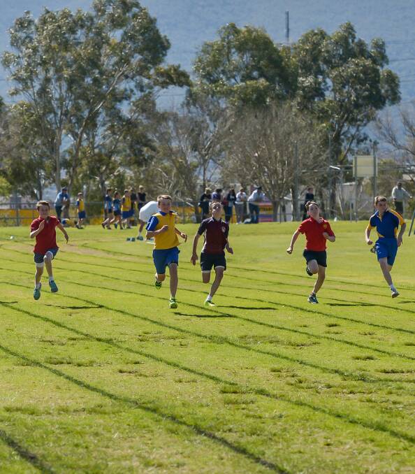 Olympic fever: The heat was on in the 100m dash at the Diocesan carnival in Tamworth with the fastest runners from all schools lining up in all age groups.  Photo: Peter Hardin 190816PHC25