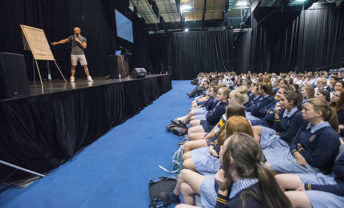A tale of two men: Luke Kennedy addresses hundreds of local year nine students with his uncensored tale of drug addiction. Photo: Peter Hardin