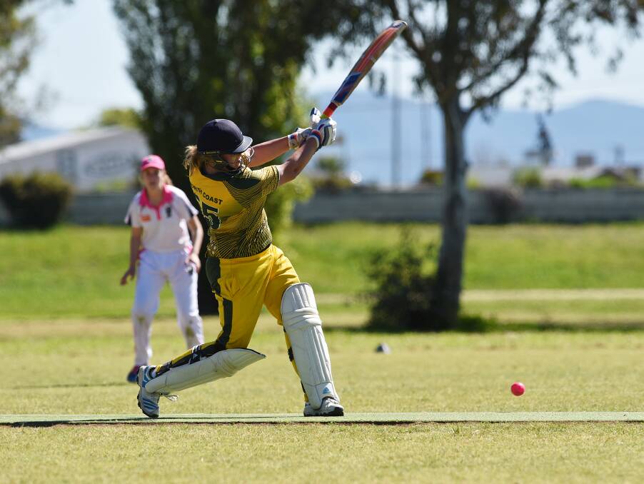 Top score: North Coast's Kaitlyn Beaumont blasts this ball back down the wicket on her way to 73 in the final against Riverina. Photo: 280916GGE07
