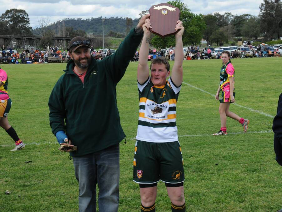 Coach and Captain: Jillaroos coach Chris Cooney and skipper Robyn Broadbent hold up the Plate after becoming the first name on the trophy.