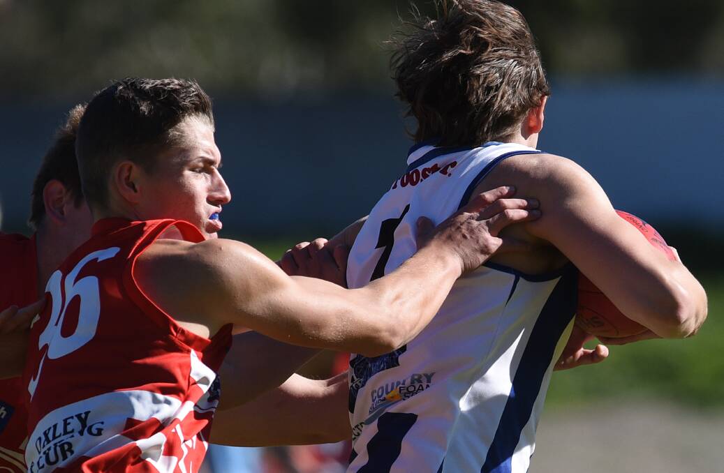  Swans' Lachie Pallot tackles Roos star Alex Hudson. The young star has been on the improve all season with the Tamworth club. 300716GGE05