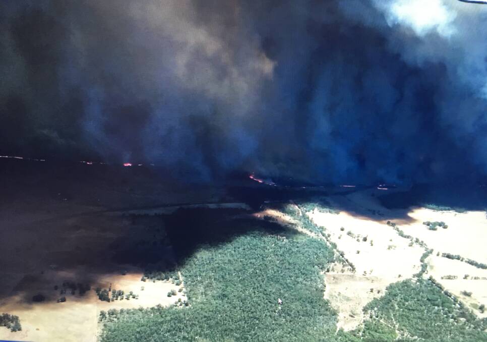 Fire front: An aerial view of the Sir Ivan fire which broke out last weekend as Tamworth and Liverpool Plains RFS units continue to send out vehicles and crews to help contain and mop up this weekend.