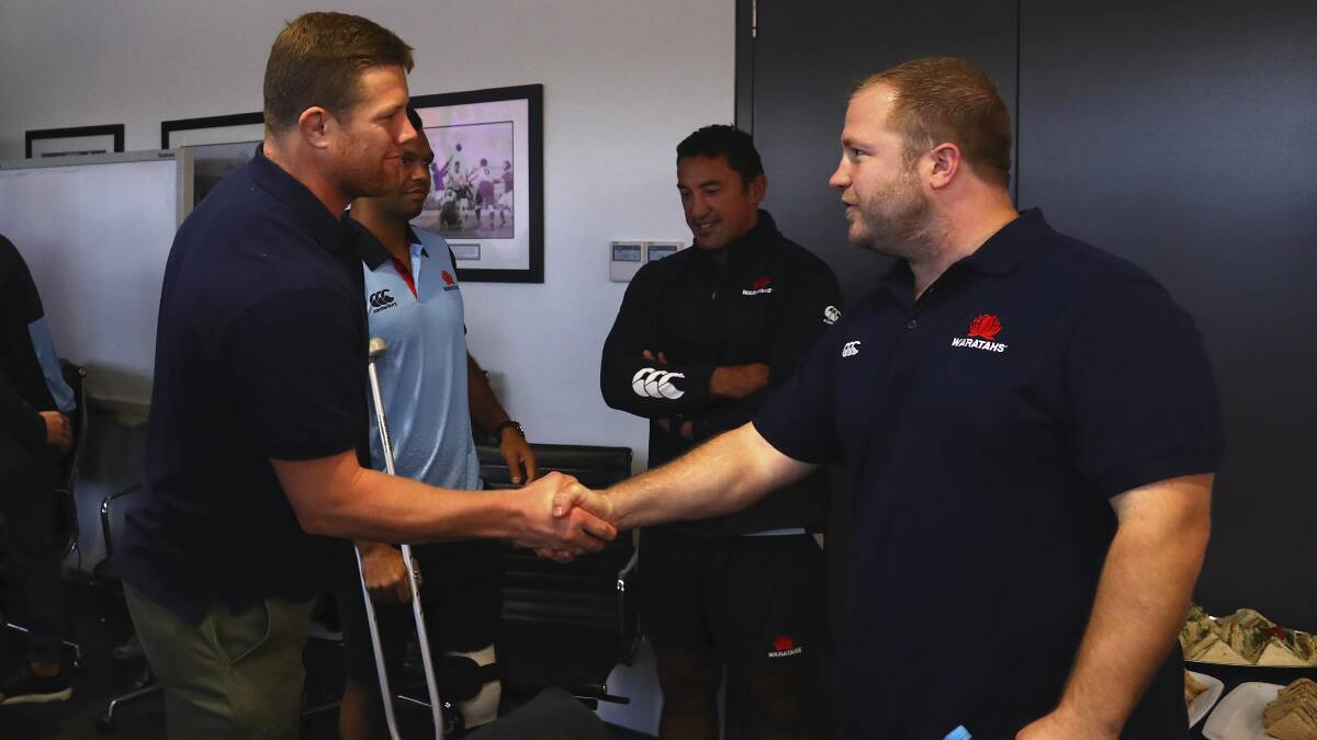 Prop shake: Eagles skipper and Tamworth product Paddy Ryan shakes fellow Waratah Benn Robinson's hand. Ryan will be hoping to claim the first ever Benn Robinson Bell this weekend as the eagles take on the Western Rams.