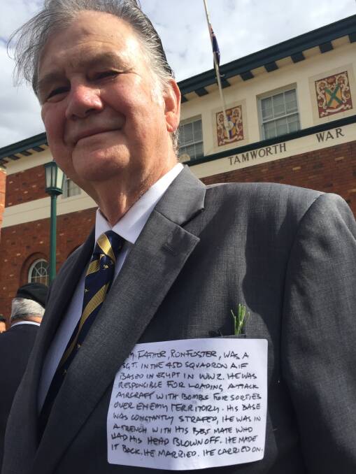 Father's son: Former councillor David Foster wore a short story from his father's time in WWII on his chest when he marched for the first time on Tuesday.
